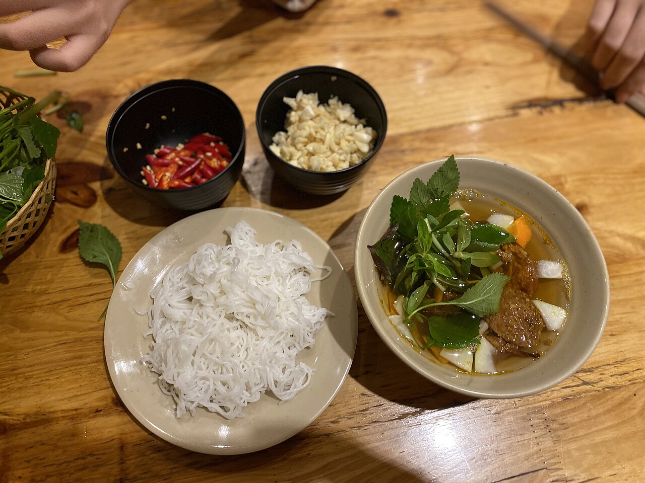 Bún chả with chili peppers and fresh garlic