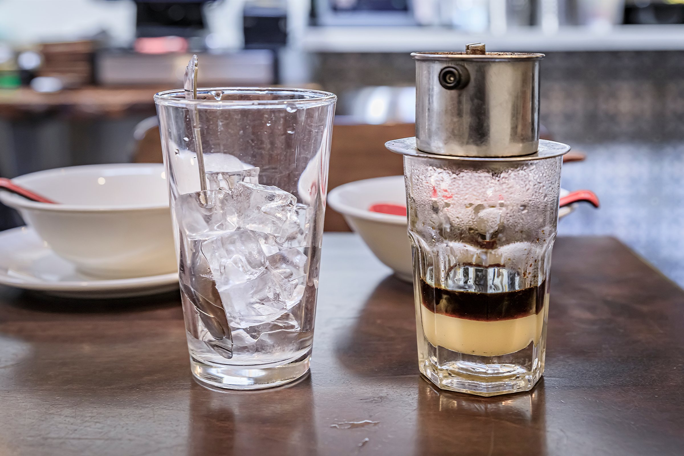Traditional Vietnamese dark roast drip coffee with condensed milk, Ca Phe Sua Da at a coffee shop restaurant