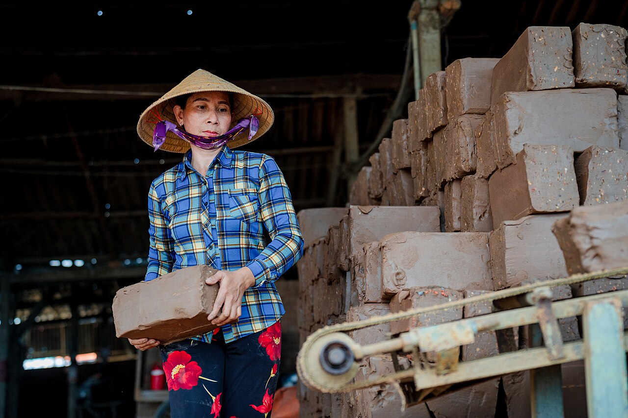 A woman is working at a brick kiln in Vinh Long, Vietnam
